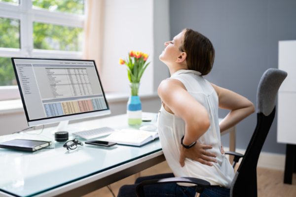 Woman in pain at desk