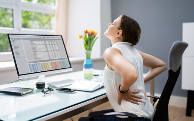 Woman in pain at desk